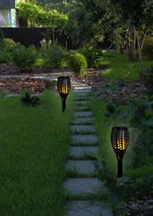 Solar Tiki Torch Lights Along Pathway